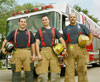 Fire fighters in front of a truck