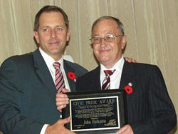 Volunteer Receiving an award from Mayor Diodati